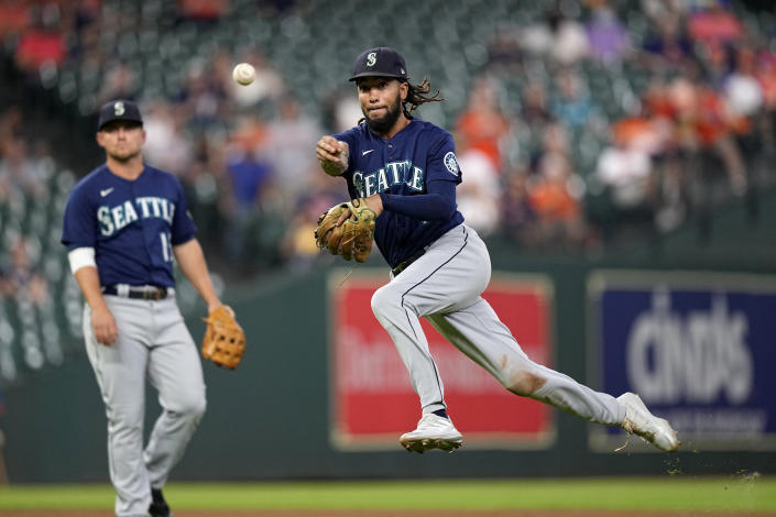 Seattle Mariners shortstop J.P. Crawford throws to first for the out after fielding a ground ball by Houston Astros' Kyle Tucker during the eighth inning of a baseball game Tuesday, Sept. 7, 2021, in Houston. (AP Photo/David J. Phillip)