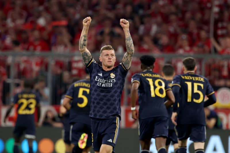 Real Madrid's Toni Kroos celebrates his side's first goal during the UEFA Champions League semi-final first leg soccer match between Bayern Munich and Real Madrid at Allianz Arena. Matthias Balk/dpa