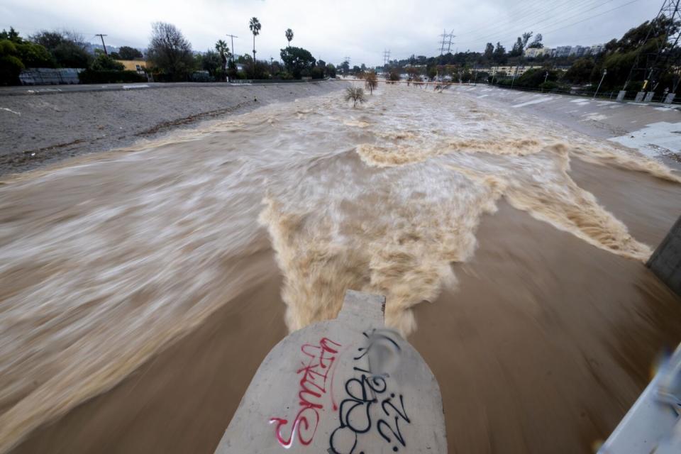 Water flows down the Los Angeles River.