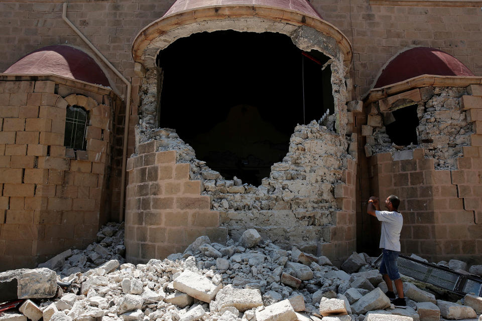 <p>A man takes pictures of a damaged church following an earthquake off the island of Kos, Greece July 21, 2017. (Photo: Costas Baltas/Reuters) </p>