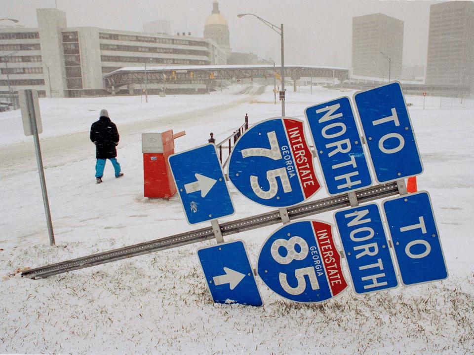 A pedestrian walks through snow in Atlanta, Georgia, in March 1993.