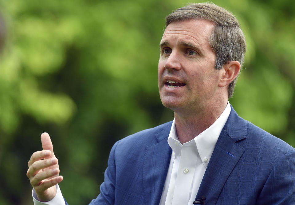 FILE - Kentucky Gov. Andy Beshear sits for an interview in Versailles, Ky., May 17, 2023. Beshear has seized a commanding fundraising lead over Republican challenger Daniel Cameron in their marquee matchup in Kentucky, their latest campaign finance reports showed. (AP Photo/Timothy D. Easley, File)