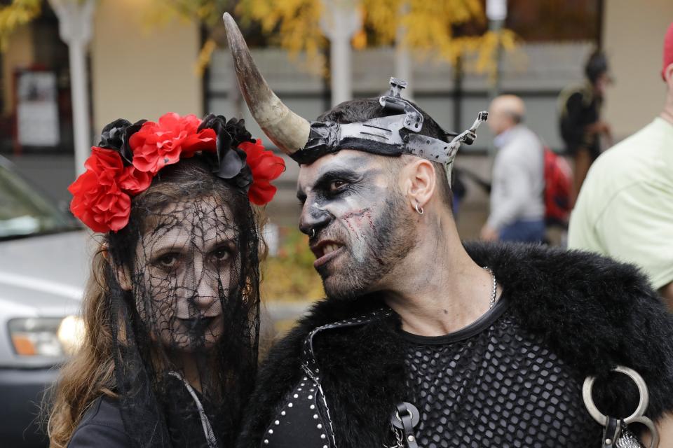 Revelers gather before the Greenwich Village Halloween Parade, Thursday, Oct. 31, 2019, in New York. (AP Photo/Frank Franklin II)