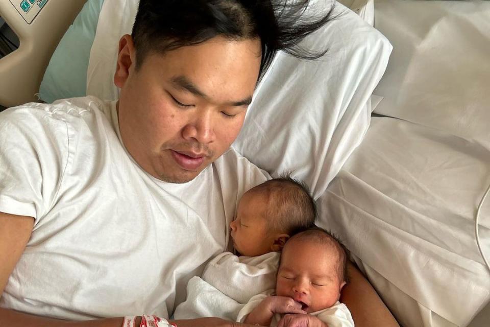 <p>Buddha Lo/Instagram</p> Buddha Lo poses for a photo with his newborn twins in October 2023