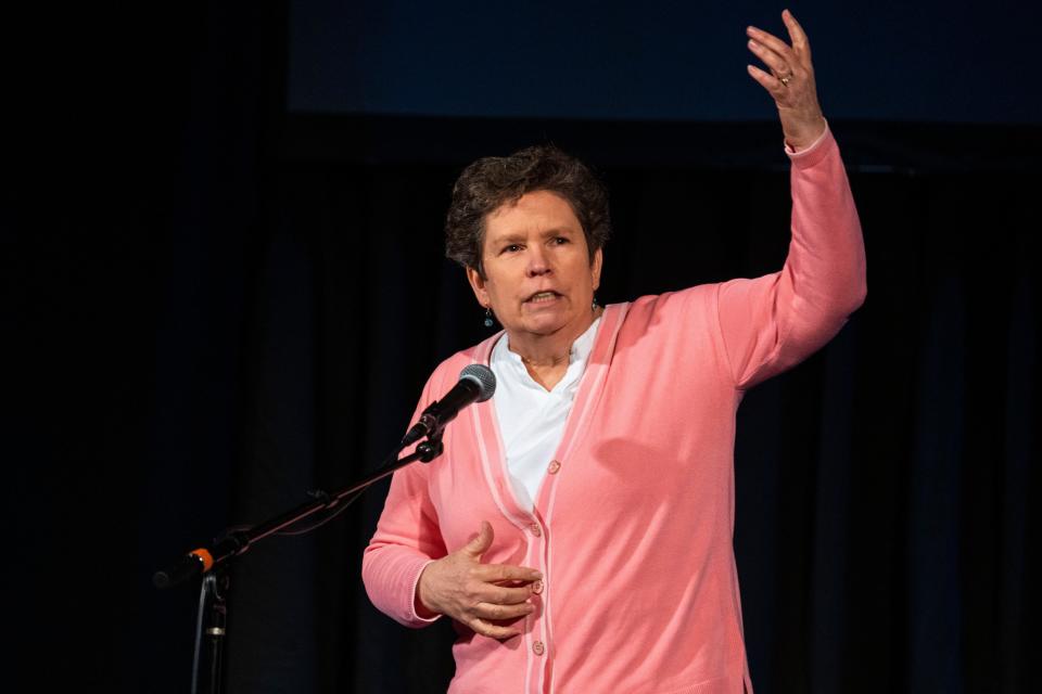 Susan Sims tells a story during the Des Moines Storytellers Project's "Travel" show at Hoyt Sherman Place on Tuesday, June 20, 2023, in Des Moines.