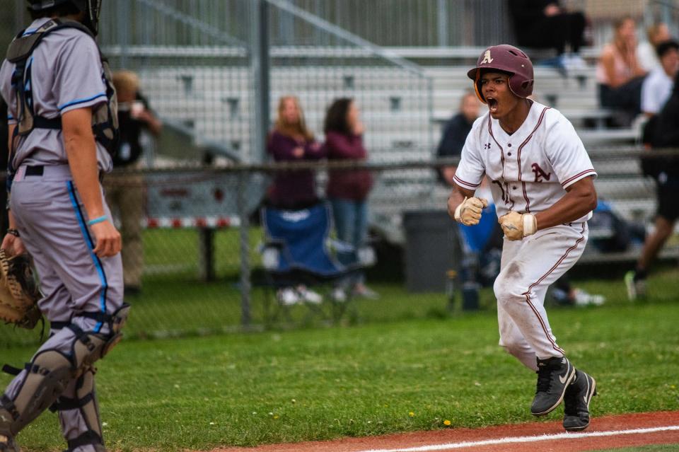 Arlington's Eric Santaella celebates his run to home plate during the Section 1 baseball game at Arlington High School in Freedom Plains, NY on Tuesday, April 30, 2024. Arlington defeated John Jay East Fishkill 6-5. KELLY MARSH/FOR THE POUGHKEEPSIE JOURNAL