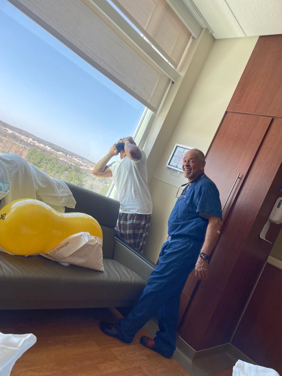 Father Nathaniel Mathis and Dr. Taylor view the solar eclipse from a hospital room at St. Joseph Mishawaka Medical Center (5215 Holy Cross Pkwy, Mishawaka, IN 46545) on April 8, 2024.