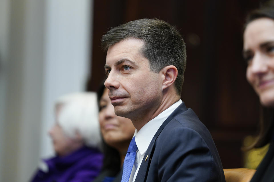 Transportation Secretary Pete Buttigieg attends a meeting with President Joe Biden's "Investing in America Cabinet," in the Roosevelt Room of the White House, Friday, May 5, 2023, in Washington. (AP Photo/Evan Vucci)