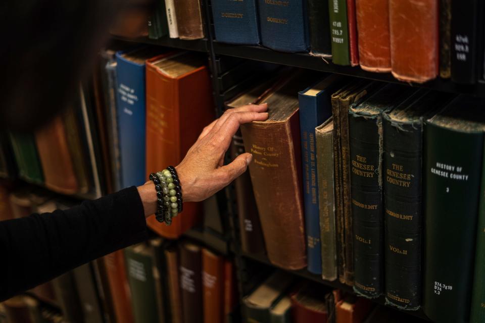 Detroit native Karen Batchelor of Southfield looking for record books at the Burton Historical Collection of the Detroit Public Library on Wednesday, March 15, 2023.