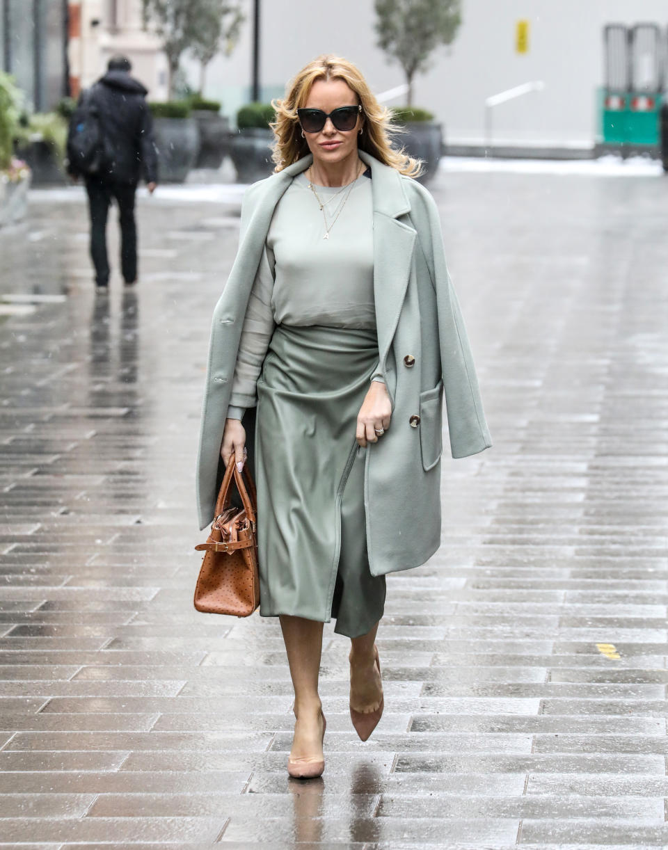 Amanda Holden heads to the Global Radio Studios in London wearing leather midi skirt from M&S (Getty Images)
