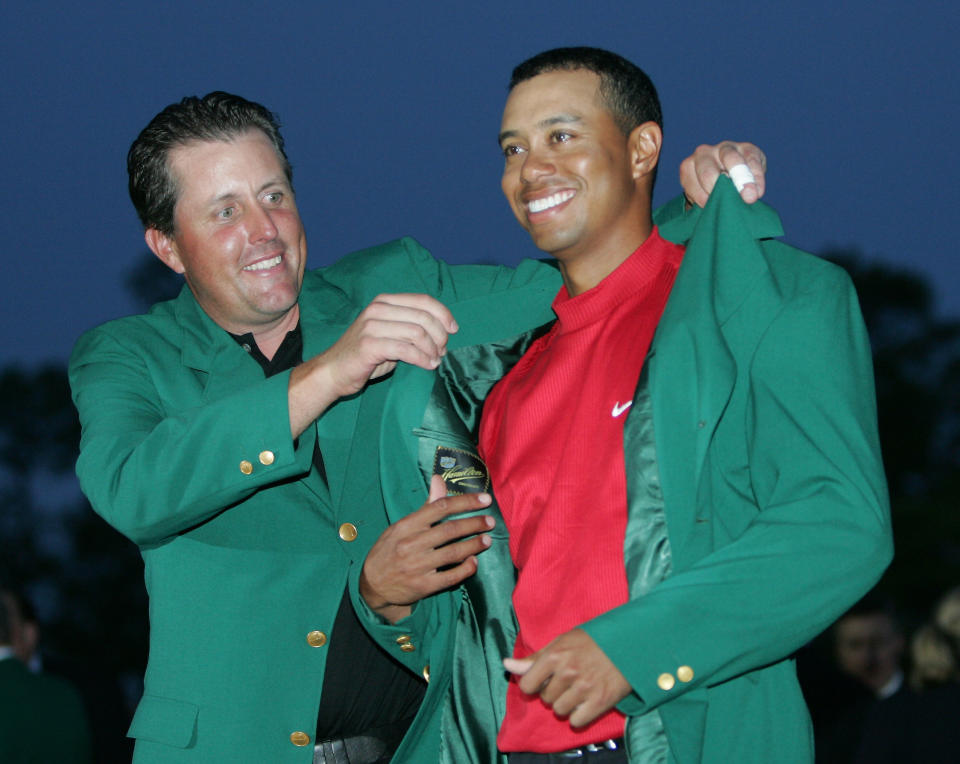 <p>Tiger Woods, right, gets the Green Jacket from Phil Mickelson, left, after winning the 2005 Masters at the Augusta National Golf Club in Augusta, Ga., Sunday, April 10, 2005. This is Woods’ foruth Masters victory. (AP Photo/Morry Gash) </p>