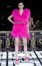 <b>Atelier Versace SS13 <br></b><br>This model teamed her fuchsia pink fur dress with an embellished belt and matching pink shoes.<br><br>© Rex