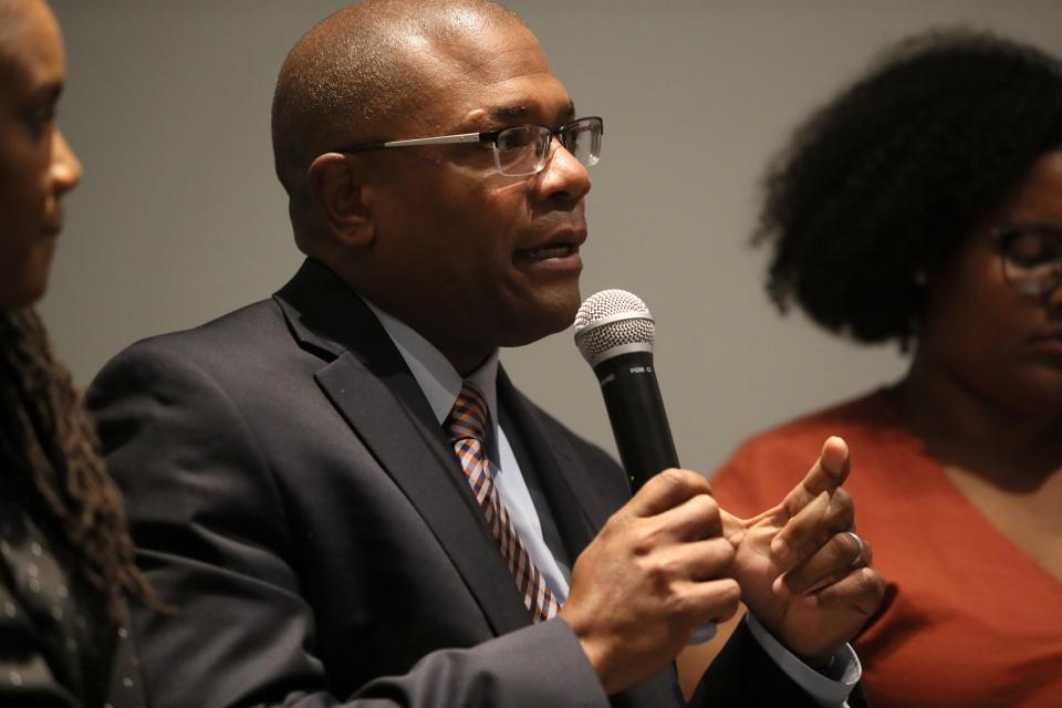 Marlon Foster of the non-profit community organization Knowledge Quest, speaks during a panel discussion and film screening addressing problems around the Memphis housing crisis at the CMPLX in Orange Mound on Monday, April 15, 2019.
