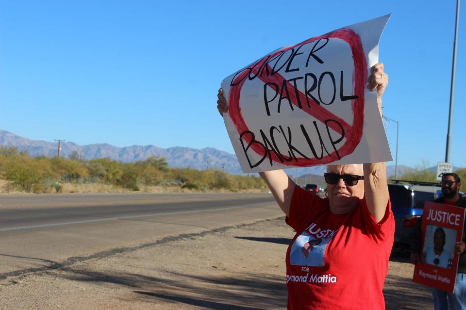 The family of Raymond Mattia and attendees gather outside of the Tohono O'odham Nation Police Department in Sells, Arizona, for a peaceful protest calling for more accountability from the department on Friday, December 15, 2023.