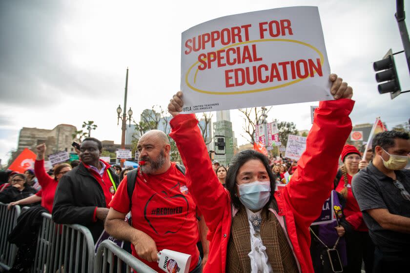 Los Angeles, CA - March 15: A crowd gathered in Grand Park infant of City Hall on Wednesday, March 15, 2023, in Los Angeles, CA. United Teachers of Los Angeles and SEIU 99 members hold a joint rally at Grand Park in a historic show of solidarity. It has been almost ten months since the contract between LAUSD and UTLA has expired, and a staggering three years for SEIU members, leaving almost 60,000 employees vulnerable in the midst of a record-high inflation and a housing crisis. (Francine Orr / Los Angeles Times)