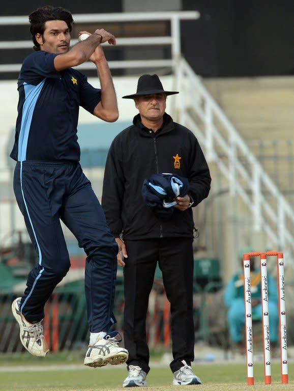 Pakistan fast bowler Mohammad Irfan delivers a ball during a team practice session at the Gaddafi stadium in Lahore on December 17, 2012. A towering man of seven feet one inch, fast-rising Pakistan paceman Irfan often struggles to find bowling shoes that fit and a comfortable bed