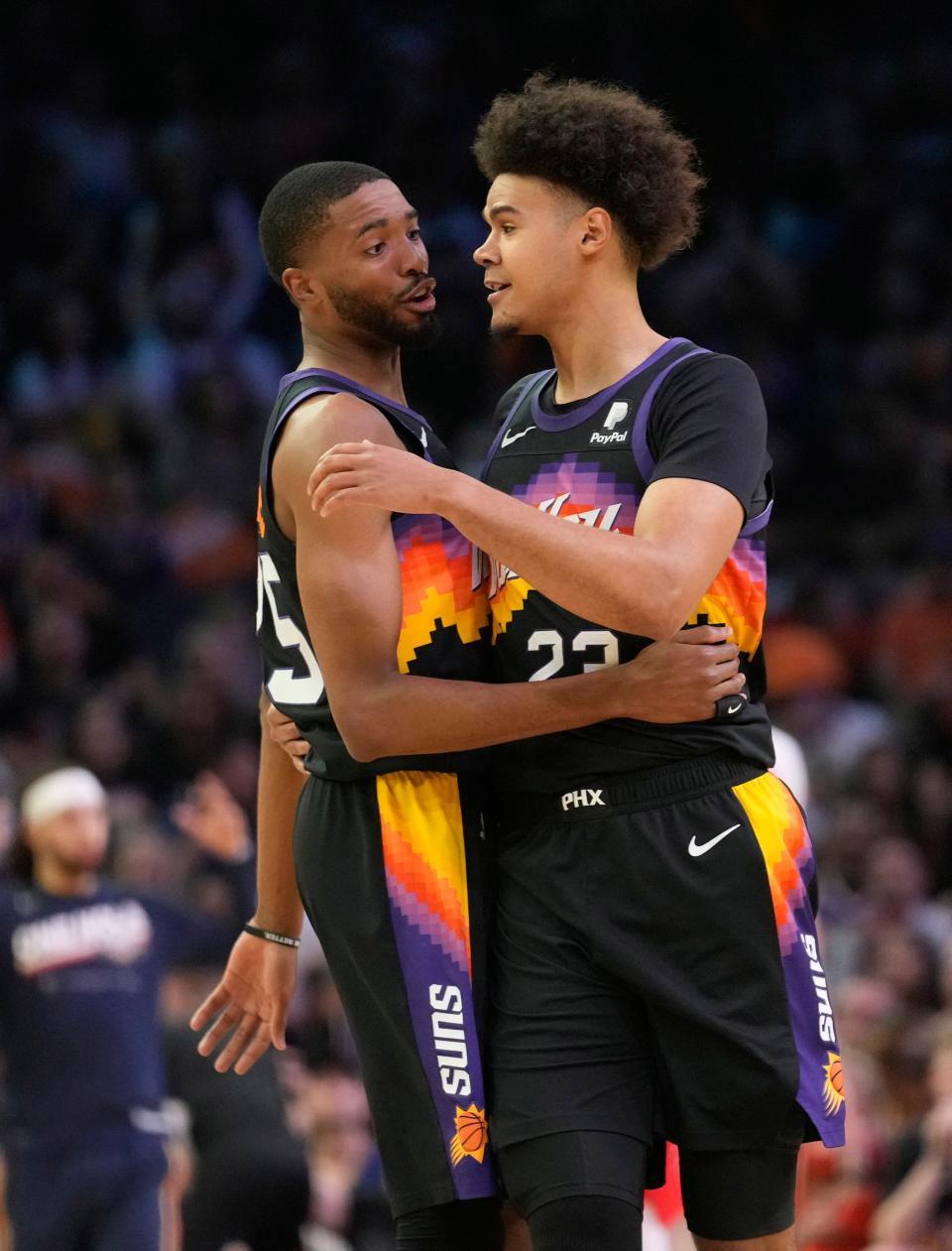 Apr 17, 2022; Phoenix, Arizona, U.S.;  Phoenix Suns forward Mikal Bridges (25) and Phoenix Suns forward Cameron Johnson (23) talk during Game 1 of the Western Conference playoffs against the New Orleans Pelicans.