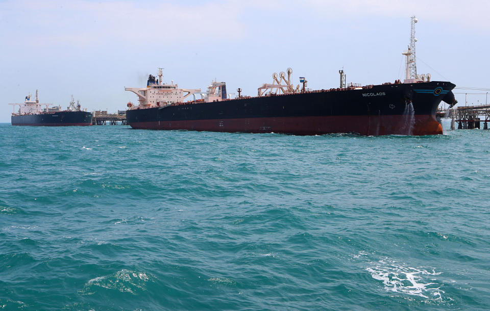 FILE - In this July 17, 2019 file photo, oil tankers load crude oil at Iraq's Al-Basra Offshore Terminal in Basra, Iraq. The historic crash in oil prices in the wake of the novel coronavirus pandemic is reverberating across the Middle East as crude-dependent countries scramble to offset losses from a key source of state revenue. While some Gulf countries can rely on a cushion of foreign currency reserves, nowhere in the region are the circumstances more dire than in Iraq, where oil sales fund 90% of the state budget. (AP Photo/Nabil al-Jurani, File)