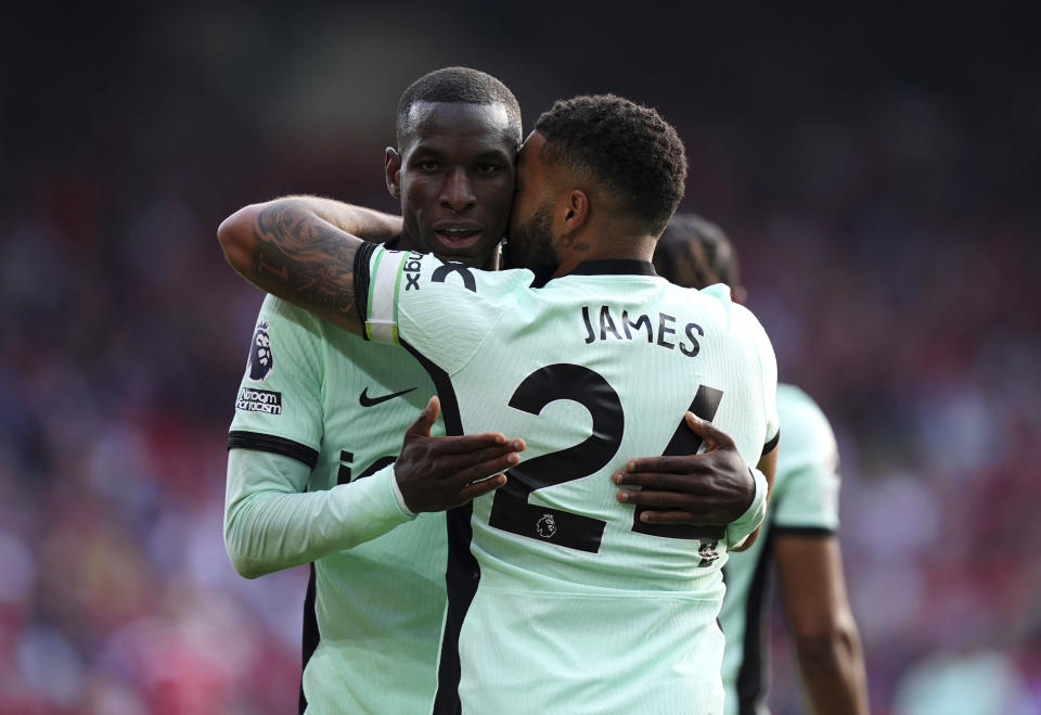 Chelsea's scorer Nicolas Jackson, left, and his teammate Reece James, right, celebrate their side's third goal during the English Premier League soccer match between Nottingham Forest and FC Chelsea in Nottingham, England, Saturday, May 11, 2024. (Mike Egerton/PA via AP)