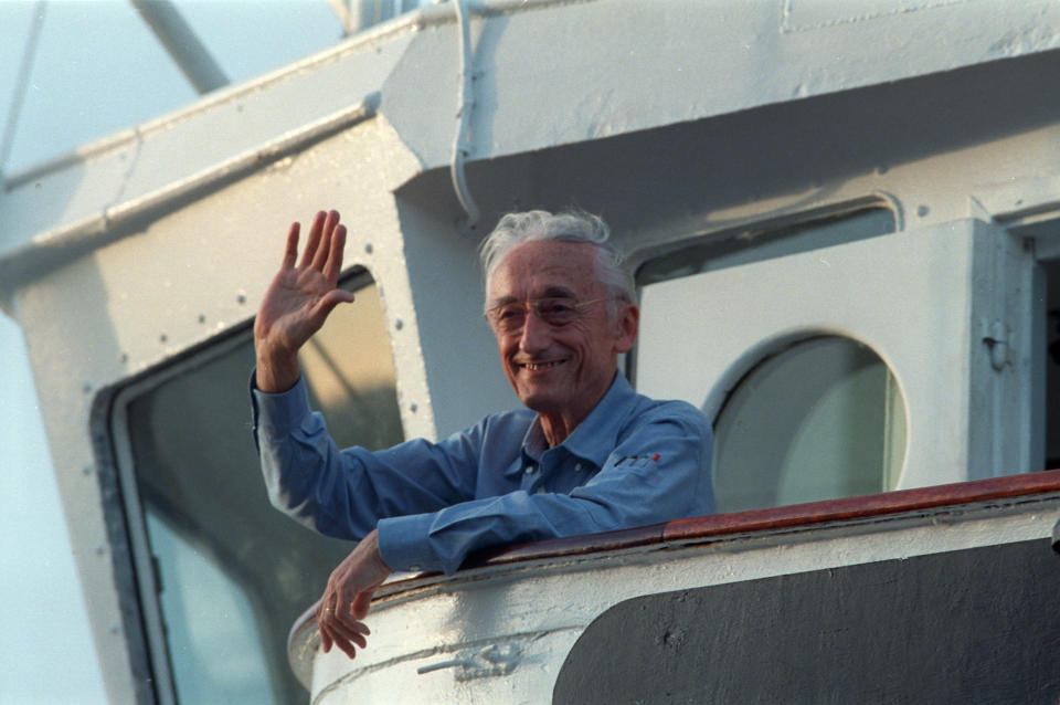 Jacques-Yves Cousteau waves to onlookers aboard his ship Calypso - Credit: ASSOCIATED PRESS