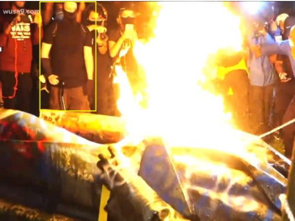 A statue of Albert Pike burns after being toppled by protesters: US Department of Justice
