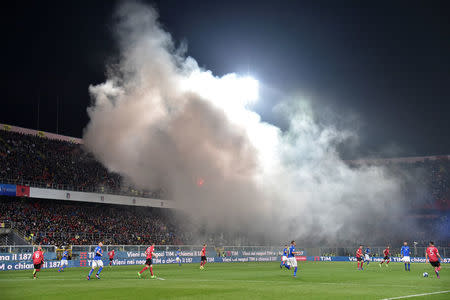 Football Soccer - Italy v Albania - World Cup 2018 Qualifiers - Group G - Renzo Barbera stadium, Palermo, Italy - 24/3/17. Smoke is seen as Albania's supporters light flares during the match. REUTERS/Alberto Lingria