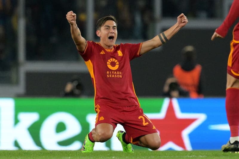 AS Roma's Paulo Dybala celebrates scoring his side's first goal during the UEFA Europe League round of 16 first leg soccer match between AS Roma and Brighton FC at the Rome's Olympic stadium. Alfredo Falcone/LaPresse via ZUMA Press/dpa