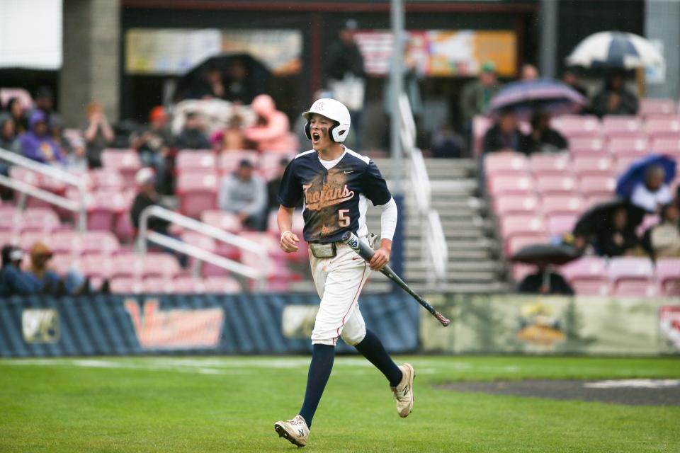Kennedy's Ethan Kleinschmit (5) reacts to scoring during the OSAA 2A/1A state championship against Umpqua Valley Christian on Friday, June 3, 2022, at Volcanoes Stadium in Keizer, Ore.