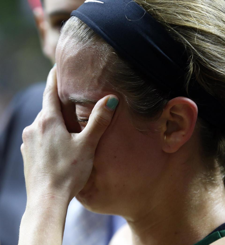 Baylor guard Makenzie Robertson reacts losing to Notre Dame 88-69 in their NCAA women's college basketball tournament regional final game at the Purcell Pavilion in South Bend, Ind., Monday, March 31, 2014. (AP Photo/Paul Sancya)