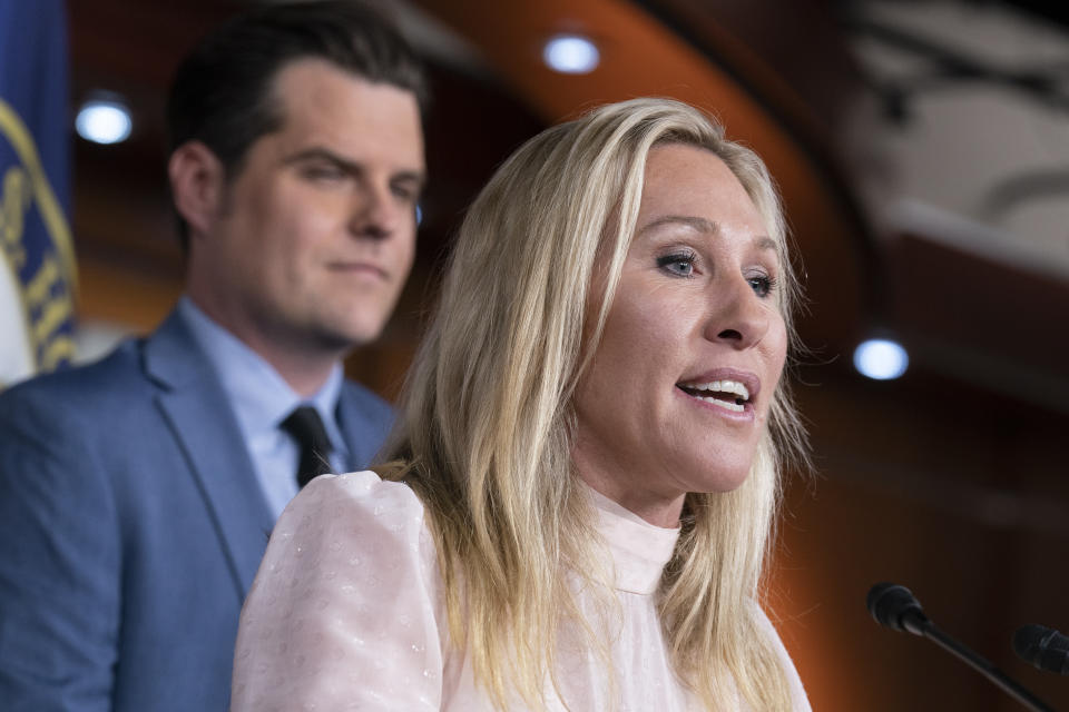 FILE - Rep. Marjorie Taylor Greene, R-Ga., joined at left by Rep. Matt Gaetz, R-Fla., speaks at a news conference about the treatment of people being held in the District of Columbia jail who are charged with crimes in the Jan. 6 insurrection, at the Capitol in Washington, Dec. 7, 2021. (AP Photo/J. Scott Applewhite, File)