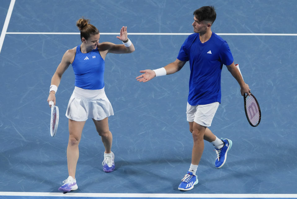 Maria Sakkari and Petros Tsitsipas of Greece react after winning a point against Germany's Laura Siegemund and Alexander Zverev during their United Cup doubles quarterfinal tennis match in Sydney, Australia, Friday, Jan. 5, 2024. (AP Photo/Mark Baker)