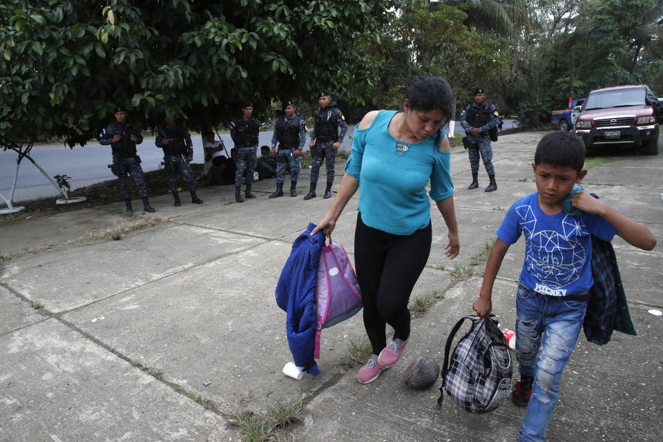 Honduran migrants traveling with a larger group prepare to be deported after being stopped by Guatemalan police in Morales, Guatemala, Thursday, Jan. 16, 2020. Less-organized migrants, tighter immigration control by Guatemalan authorities and the presence of U.S. advisers have reduced the likelihood that the hundreds of migrants who departed Honduras will form anything like the cohesive procession the term “caravan” now conjures. (AP Photo/Moises Castillo)