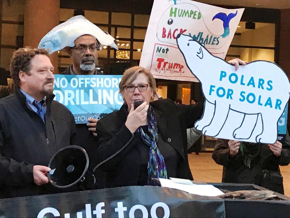 In this Feb. 15, 2018 file photo, Judith Enck, center, former regional administrator for the Environmental Protection Agency, addresses those gathered at a protest against President Trump's plan to expand offshore drilling for oil and gas in Albany, N.Y.  A U.S. judge in Alaska says President Donald Trump exceeded his authority when he reversed a ban on offshore drilling in vast parts of the Arctic Ocean and dozens of canyons in the Atlantic Ocean. Judge Sharon Gleason in a ruling Friday, March 29, 2019 threw out Trump’s executive order that overturned the ban implemented by President Barack Obama.