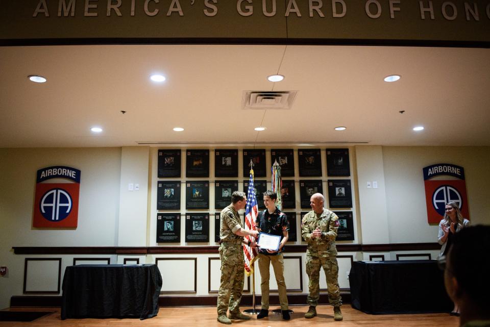 Daniel Conley, center, is congratulated by Brig. Neil Den-McKay, left, after Conley was named the 82nd Airborne Division's junior paratrooper of the year on Thursday, April 21, 2022.