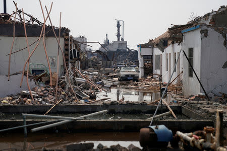 Damaged buildings are seen on the site following an explosion at a pesticide plant owned by Tianjiayi Chemical, in Xiangshui county, Yancheng, Jiangsu province, China March 23, 2019. REUTERS/Aly Song