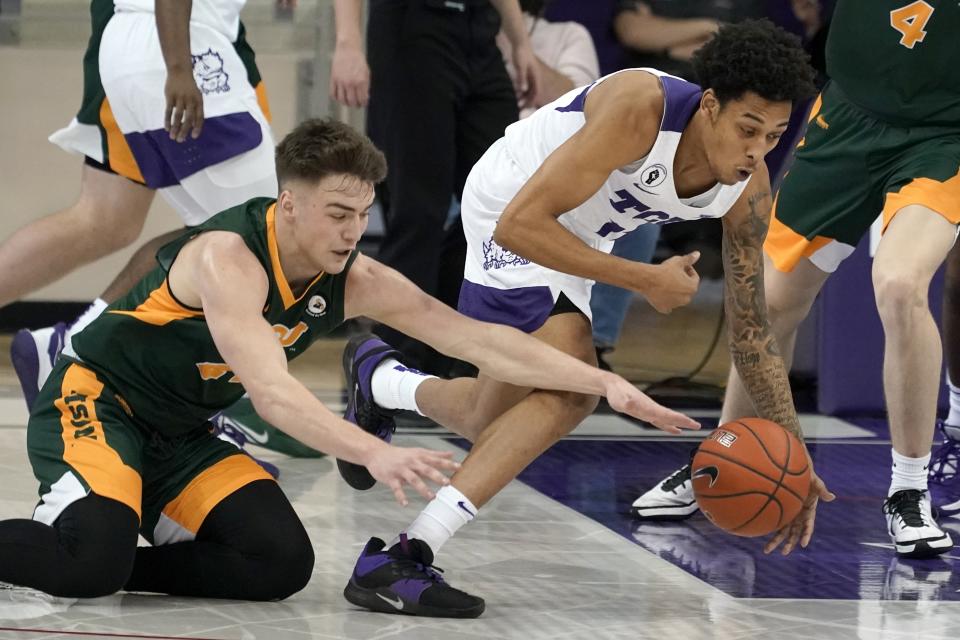 North Dakota State guard Boden Skunberg, left, and TCU guard Taryn Todd, right, compete for a loose ball in the second half of an NCAA college basketball game in Fort Worth, Texas, Tuesday, Dec. 22, 2020. (AP Photo/Tony Gutierrez)