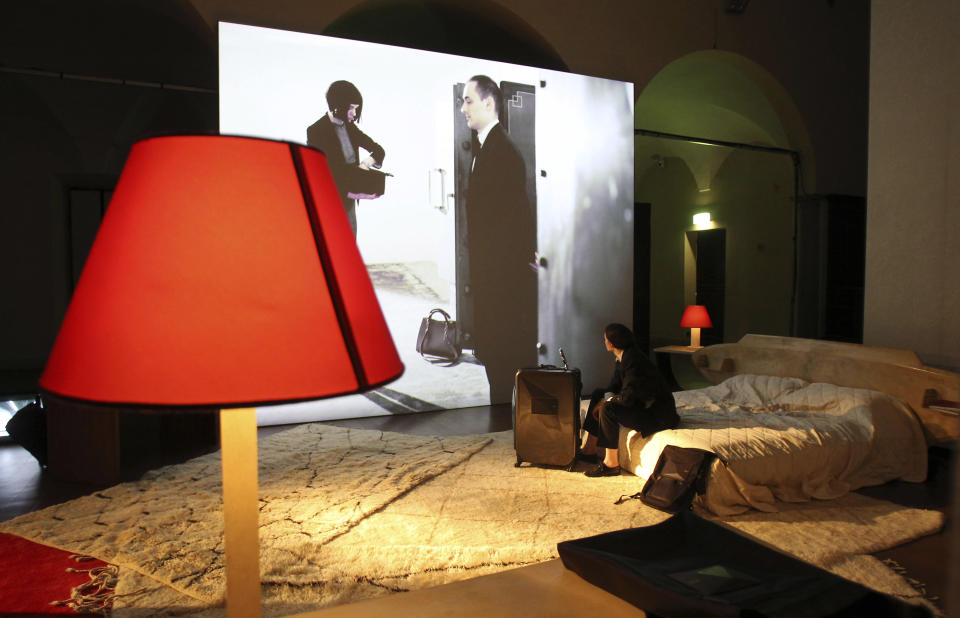 In this Friday, April 20, 2012 photo a reconstructed Milan hotel room inside the Museum of Science and Technology is seen during Milan's Furnishing Accessories Exhibition, in Milan, Italy. The Milan Furniture Fair, a six-day event which ended Sunday, was full of experiment and whimsy. (AP Photo/Antonio Calanni)