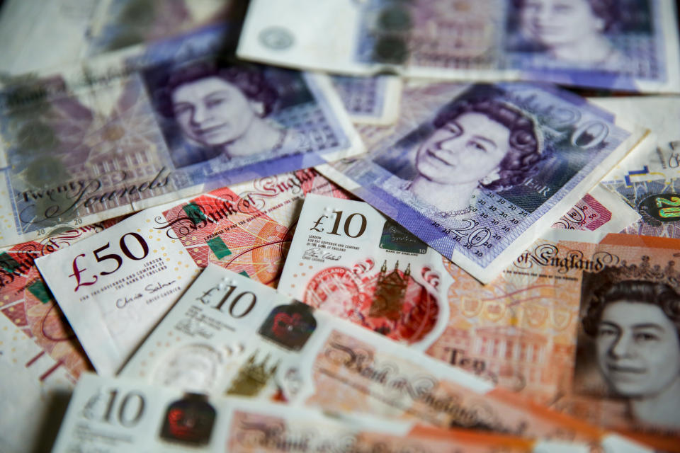 UNITED KINGDOM - 2019/08/07: In this photo illustration, British Pound sterling banknotes are seen as Pound to US Dollar exchange rates are now trading close to a 2 ½ year low, with the Pound now trading under 1.21 on the inter-bank exchange against US dollar.  If the UK leaves the European Union without a deal on 31  2019, it is forecasted that the Pound will fall to the lowest level since 1985 against US Dollar. (Photo Illustration by Steve Taylor/SOPA Images/LightRocket via Getty Images)