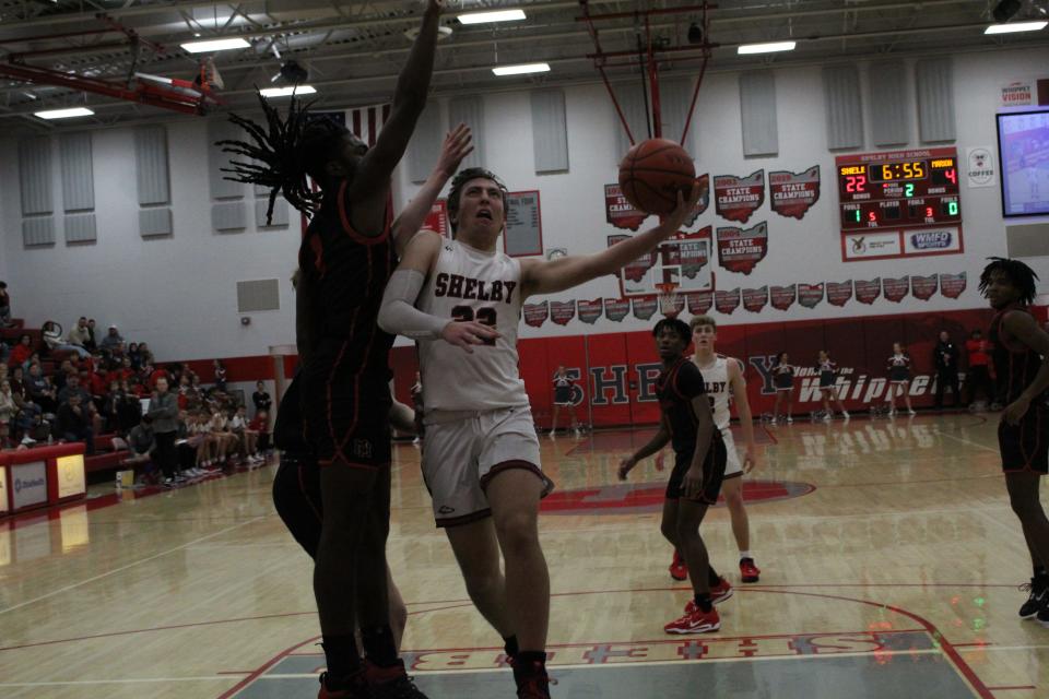 Shelby guard Max Hess drives to the basket in the Whippets 74-54 win over Marion Harding on Thursday night