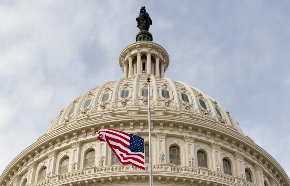 A flag flies at half-mast over the dome of the U.S. Capitol in Washington, D.C., January 10, 2011, in honor of the six people killed in the shooting in Tucson, Arizona, that also severely wounded Arizona Representative Gabrielle Giffords. SAUL LOEB/AFP/Getty Images)