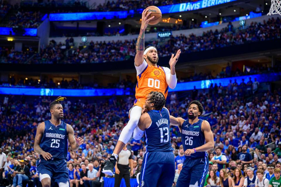 May 8, 2022; Dallas, Texas, USA; Phoenix Suns center JaVale McGee (00) is called for a charge on Dallas Mavericks guard Jalen Brunson (13) during the second quarter during game four of the second round for the 2022 NBA playoffs at American Airlines Center.