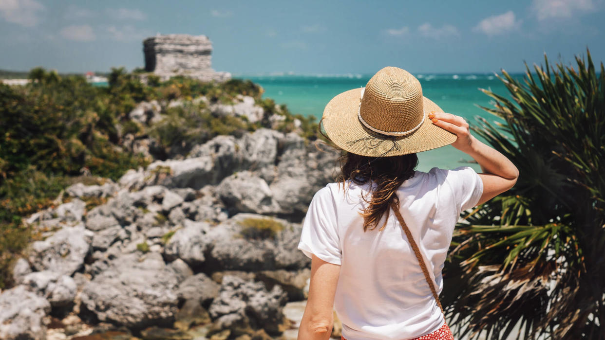 girl with hat in Tulum Ruins