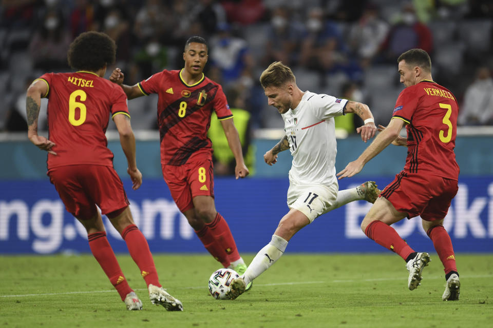 Italy's Ciro Immobile takes a shot during a Euro 2020 soccer championship quarterfinal match between Belgium and Italy at the Allianz Arena in Munich, Germany, Friday, July 2, 2021. (Andreas Gebert/Pool Photo via AP)