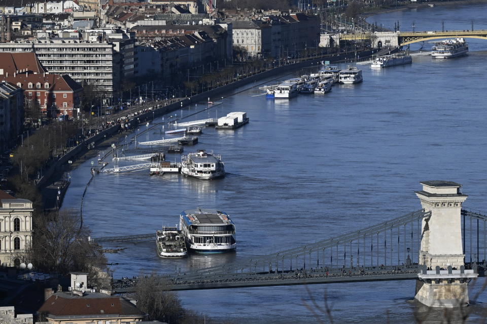 The Sztehlo Gabor quay is flooded by the river Danube in Budapest, Hungary, Wednesday, Dec. 27, 2023. Due to the recent rains and snow, the water level of the Danube has risen. River Danube is expected to peak on the morning of December 28. (Tamas Kovacs/MTI via AP)