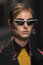 <p><i>White striped <em>Matrix</em>-style sunglasses from the SS18 Prada collection. (Photo: ImaxTree) </i></p>