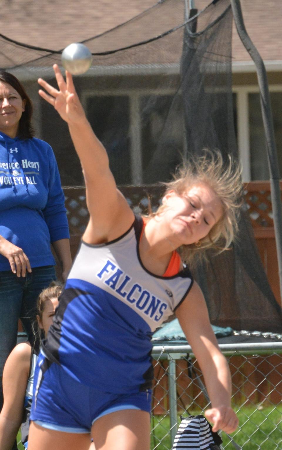 Florence-Henry's Caylin Kelly releases the shot put Tuesday during the Eastern Coteau Conference track and field meet at Allen Mitchell Field. She placed in both throwing events for the Falcons.