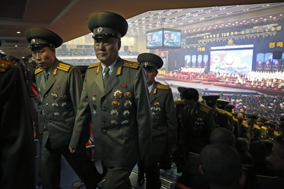 North Koreans military officers leave after an evening gala held on the eve of the 70th anniversary of North Korea's founding day in Pyongyang, North Korea, Saturday, Sept. 8, 2018. North Korea will be staging a major military parade, huge rallies and reviving its iconic mass games on Sunday to mark its 70th anniversary as a nation. (AP Photo/Kin Cheung)