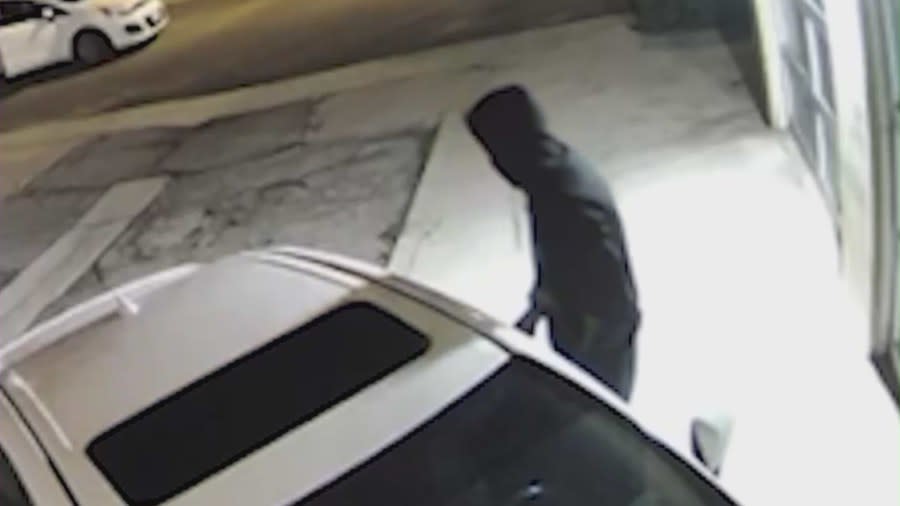 Surveillance video shows the suspect breaking into a vehicle in Playa Del Rey. Victims spoke with KTLA on April 19, 2024. (KTLA)