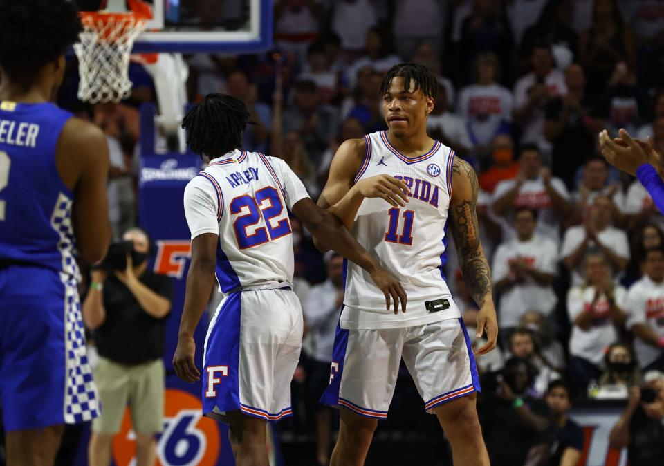 Florida Gators forward Keyontae Johnson (11) is congratulated by guard Tyree Appleby (22) as he recognized before the game against the Kentucky Wildcats on March 5, 2022.