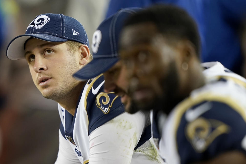 Los Angeles Rams quarterback Jared Goff, left, sits on the bench with teammates during the second half of the team's NFL football game against the San Francisco 49ers in Santa Clara, Calif., Saturday, Dec. 21, 2019. (AP Photo/Tony Avelar)